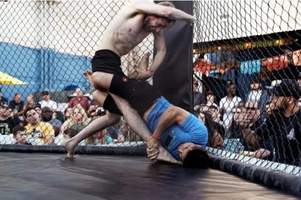 Spartan Nation Combatives and Fitness Man grabbing other Man in Fighting Competition